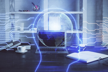Double exposure of work table with computer and brain sketch hologram. Brainstorming concept.
