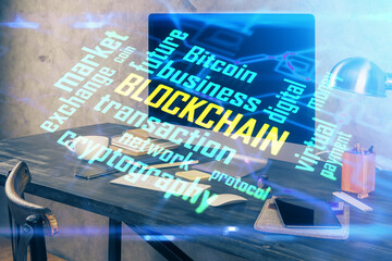 Double exposure of blockchain and crypto economy theme hologram and table with computer background....
