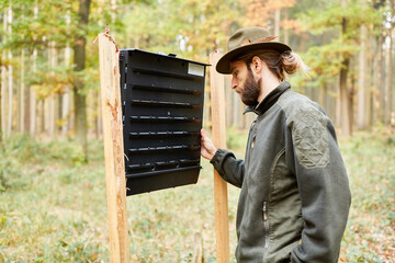 Forester controls a bark beetle slot trap