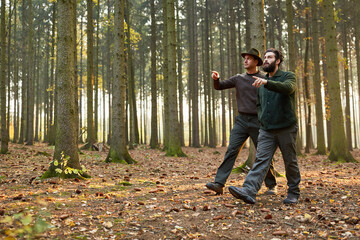 Two foresters control the trees