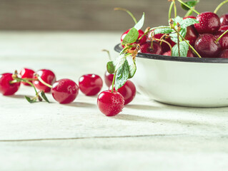 Close up image of sweet cherry on a light concrete background.