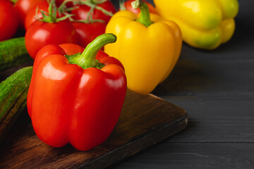 Cherry tomatoes and bell pepper on kitchen table
