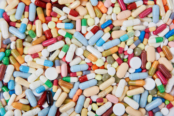 Fototapeta na wymiar Lots of colorful medicines drugs from above