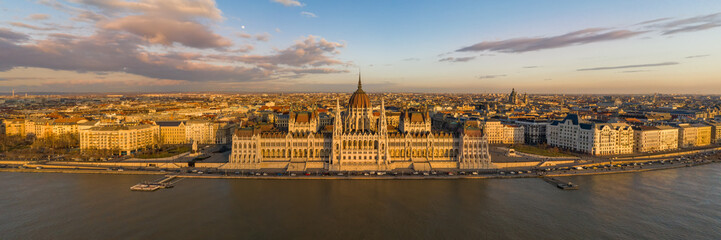 Fototapeta na wymiar Panorama aerial drone shot of Hungarian Parliament facade during Budapest sunset