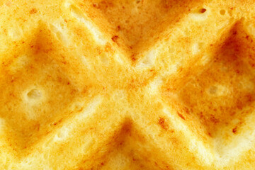 waffles Belgian, fluffy or egg waffles. Close-up traditional European dessert. food background macro textured surface.