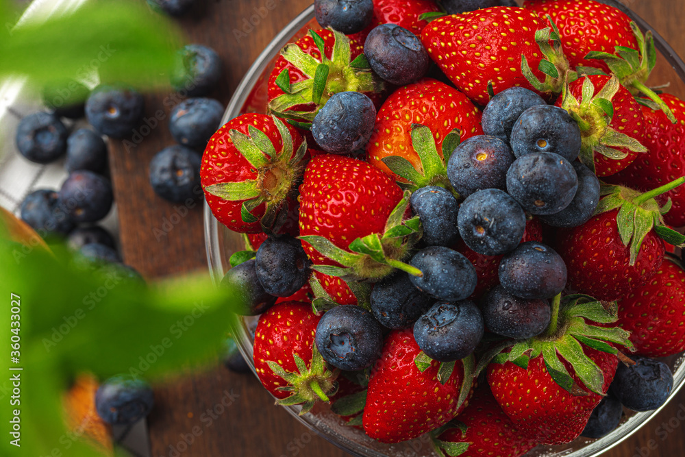 Wall mural Close up photo of blueberries and strawberries