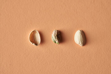 Pistachio shell and pistachio isolated on beige background, conceptual photography for food blog or advertising