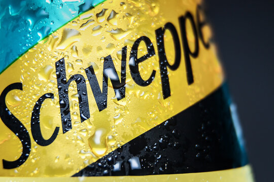 Moscow, Russia-June 16, 2020: Schweppes carbonated drink in a plastic bottle on a blue background. Schweppes is a brand of soft drinks founded by Jacob Schwepp in 1783