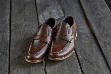 brown loafers on a wooden