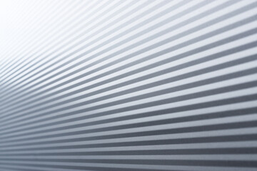 Gray corrugated Metal Sheet Wall Background with shiny reflection gradation