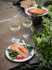 grilled salmon with salad and wine