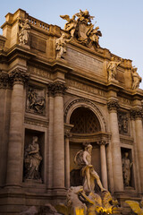 The Trevi Fountain with the statue of Neptune at the end of the day in Rome
