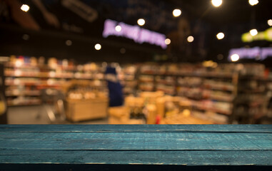 Empty wood table top on blurred market fruit. can montage or display your products