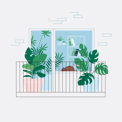 Houseplants on the balcony. Cat sleeping on the windowsill. Room full of plants, view through the window. Urban jungle concept
