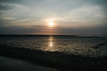 Amazing beach sunset with endless horizon in Thailand.
