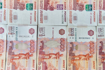 Money on Russia. Close-up of Russian rubles on five thousand and one thousand banknotes. Finance...