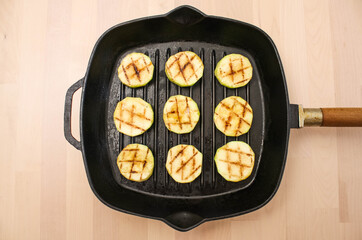 fried zucchini in a square grilled pan