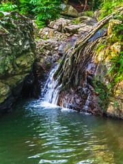 Waterfall and mountaina river in the Yanoda park, Hainan
