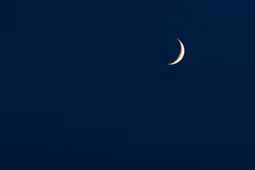 Sky background with crescent or half moon