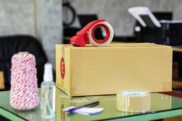 Post box packaging and cutter on the wood table in post shop