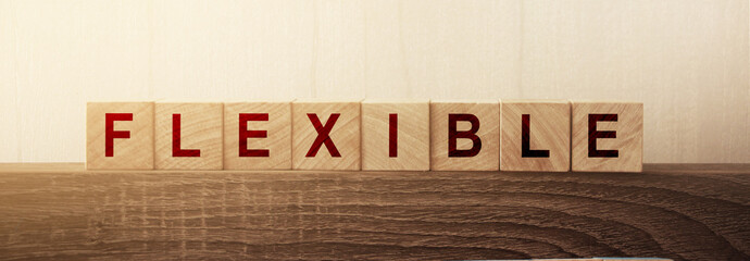 Wooden Blocks with the text: Flexible. Adapt to the new normal concept. Business and lifestyle...
