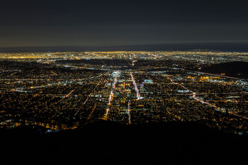 Night mountaintop view of Glendale and downtown Los Angeles in Southern California.