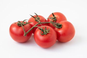 Tomatoes on the Vine with a clipping path, isolated on white.