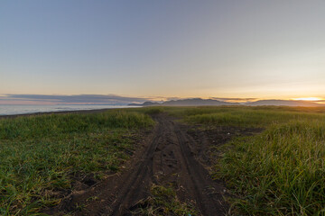 View of the Pacific coast during a sunny sunset on a clear sunny day.