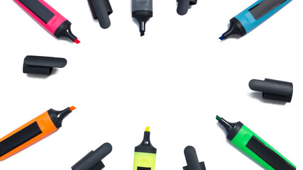 Colored highlighters on a white background.multicolored markers with open caps isolated on a white...