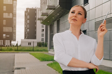 portrait of an elegant brooding woman in stylish austere clothes. The concept of a rich life in a business lady.