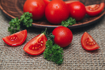 Red ripe tomatoes, cut into slices, close-up