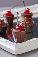 .Gourmet cherry brigadeiro. Typical Brazilian sweet with condensed milk and chocolate. Selective focus