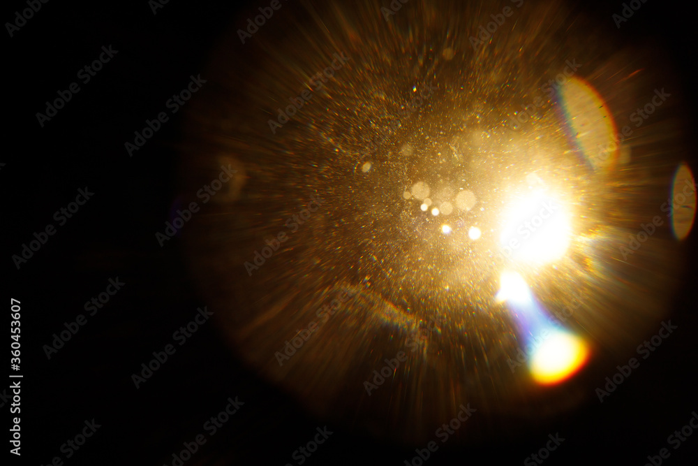 Poster Easy to add lens flare effects for overlay designs or screen blending mode to make high-quality images. Abstract sun burst, digital flare, iridescent glare over black background.