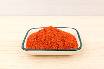 Red pepper powder on white background