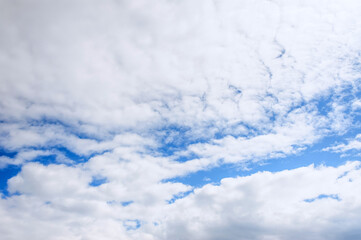 Texture of beautiful white clouds and blue sky on a sunny day. Colorful landscape. Photography,...