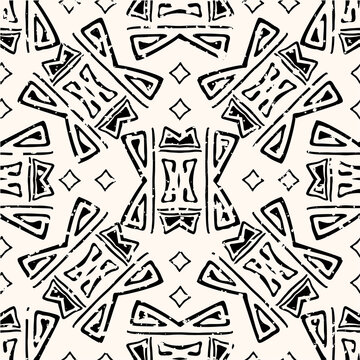 Abstract aztec seamless vector pattern background. Backdrop of black and white hand drawn shapes.With grunge texture for an aged look. Geometric ethnic repeat for environment friendly packaging