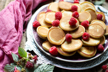 mini pancakes with fruits on a plate
