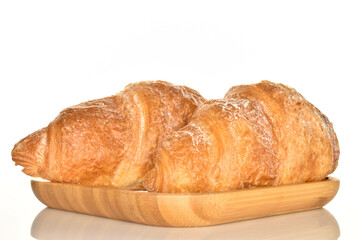 Homemade croissants, close-up, on a white background.