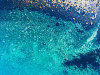 Blue sea water texture aerial drone view, water surface shot from drone, Norway, Finnmark