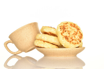Homemade cheesecakes, close-up, on a white background.