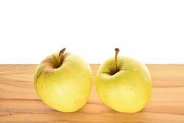 Yellow apples, close-up, on a white background.
