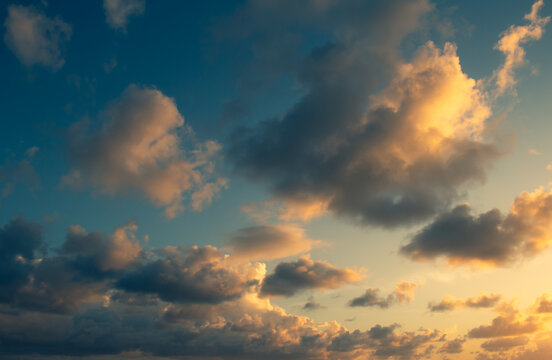 Shocking sun drop with vibrant colors. Golden clouds at sunset. Vacation landscape in the tropics.