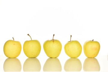 Yellow apples, close-up, on a white background.