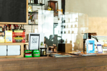 New normal plastic partition counter protect infected from covid-19 in cafe.