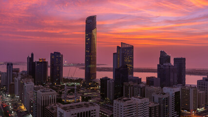 Breathtaking red sunset of Abu Dhabi skyline (United Arab Emirates)