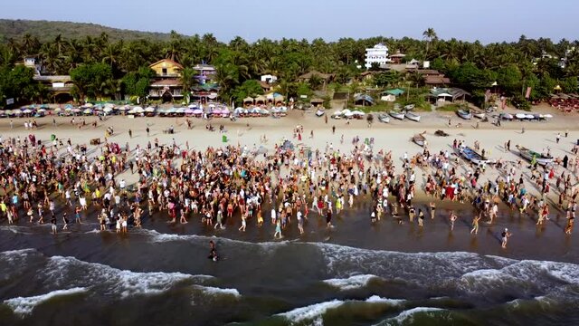 Arambol Goa India Freak Parade Carnival at the sunset beach drone fly over
