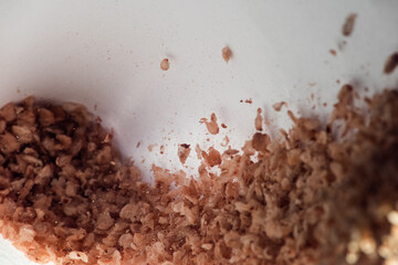 Grains of cereals fall in motion, soft focus