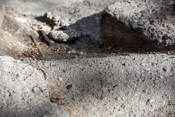 Curb damaged and old asphalt
