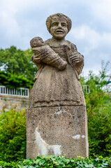 Statue of a female dwarf (carved by workshop of baroque sculptor Matthias Bernard Braun) in the garden of the castle, Nove Mesto nad Metuji, Czech republic