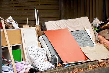 Household miscellaneous rubbish items put on curbside for council waste collection.